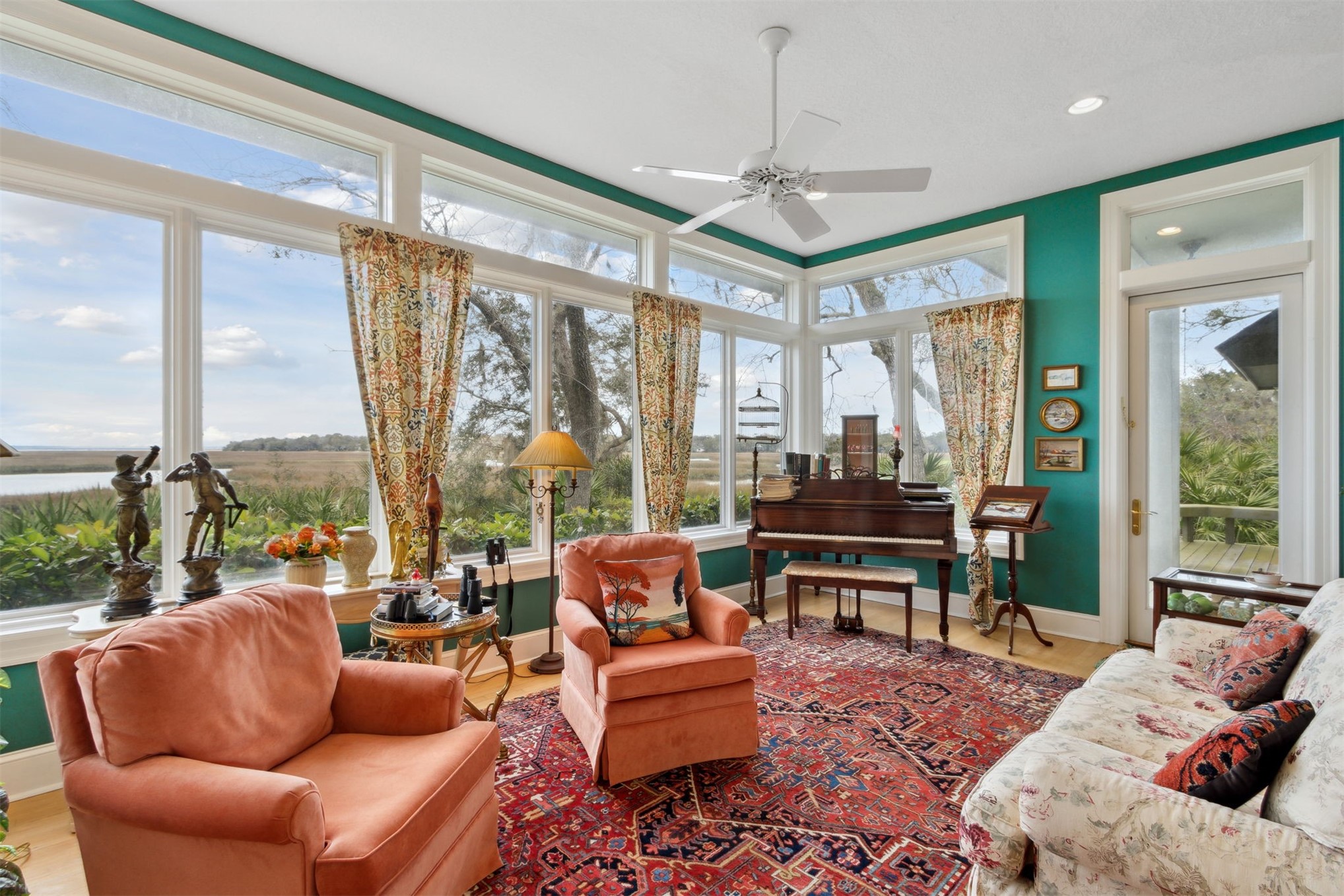 76 Marsh Creek Road Amelia Island, FL 32034 - Photo 4 of 100 a living room with furniture a ceiling fan and a large window