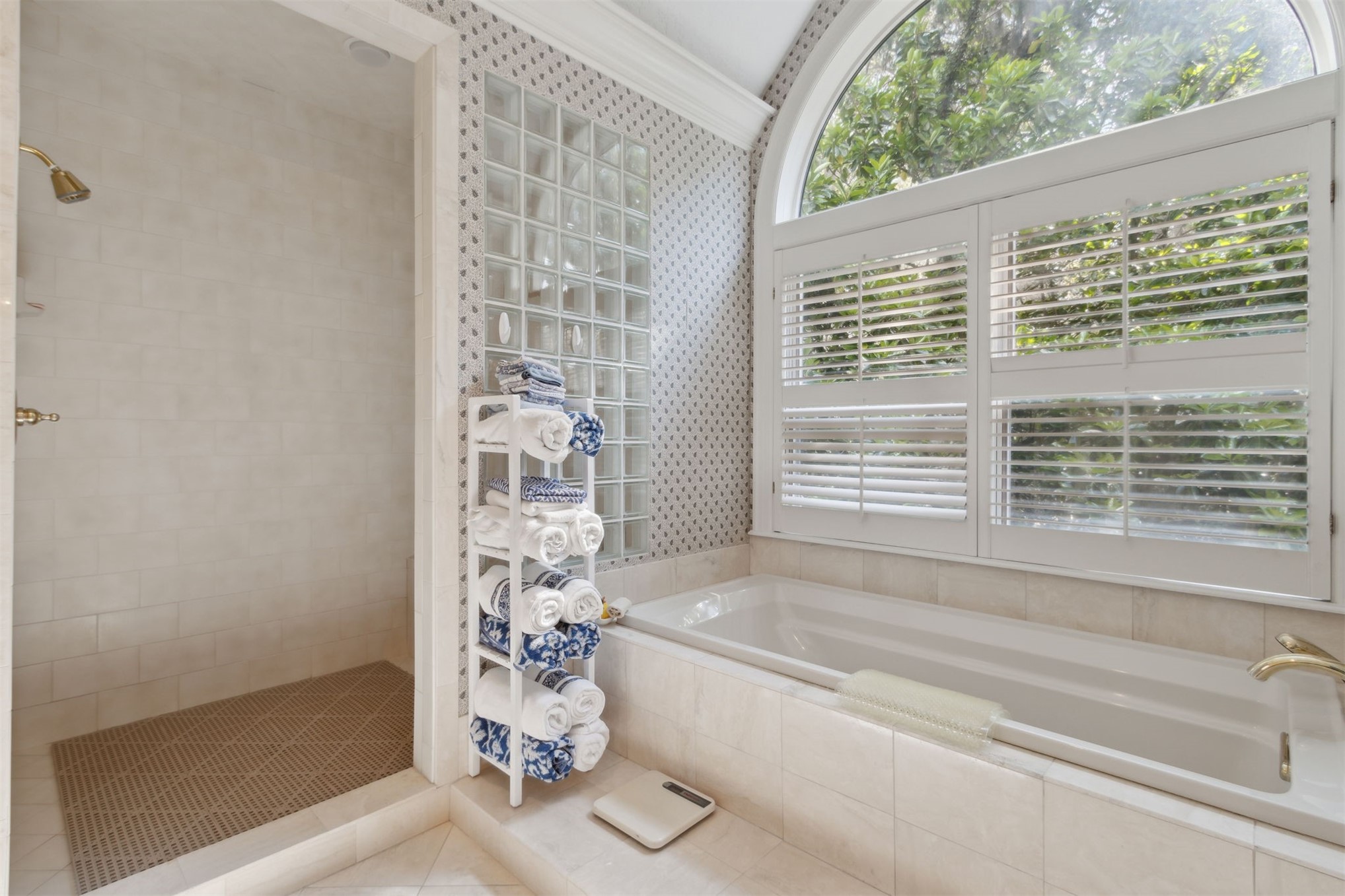 76 Marsh Creek Road Amelia Island, FL 32034 - Photo 45 of 100 a bathroom with a bathtub and a shower