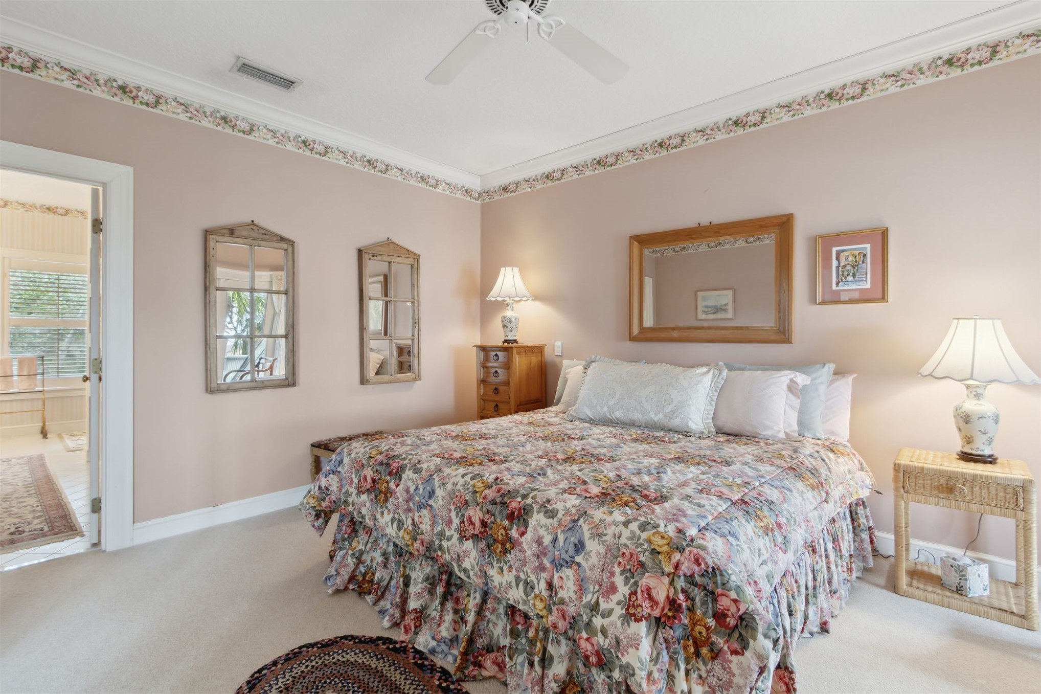 76 Marsh Creek Road Amelia Island, FL 32034 - Photo 51 of 100 a bedroom with a bed and a lamp on dresser