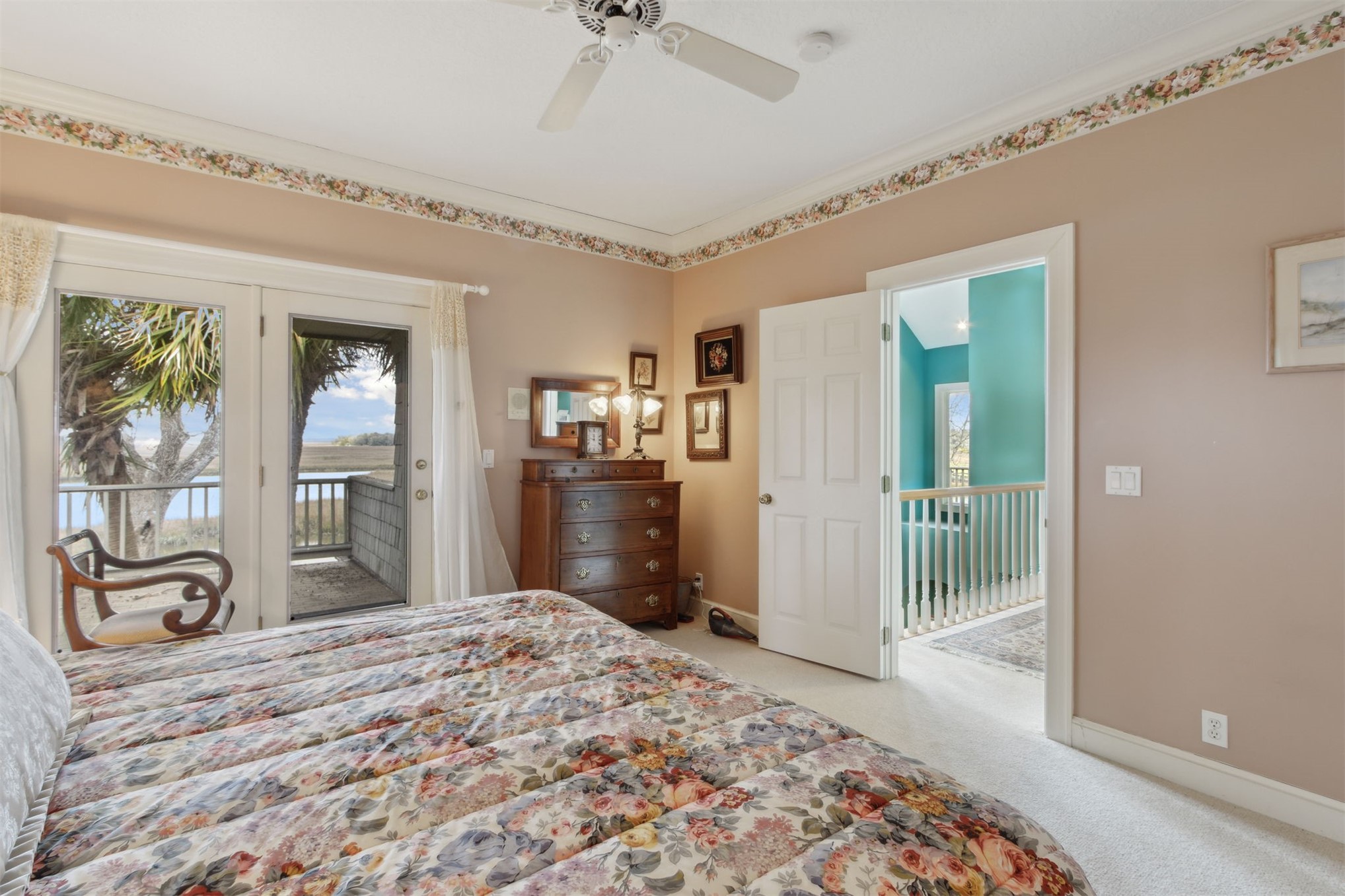 76 Marsh Creek Road Amelia Island, FL 32034 - Photo 55 of 100 a bedroom with a bed and a dresser in it