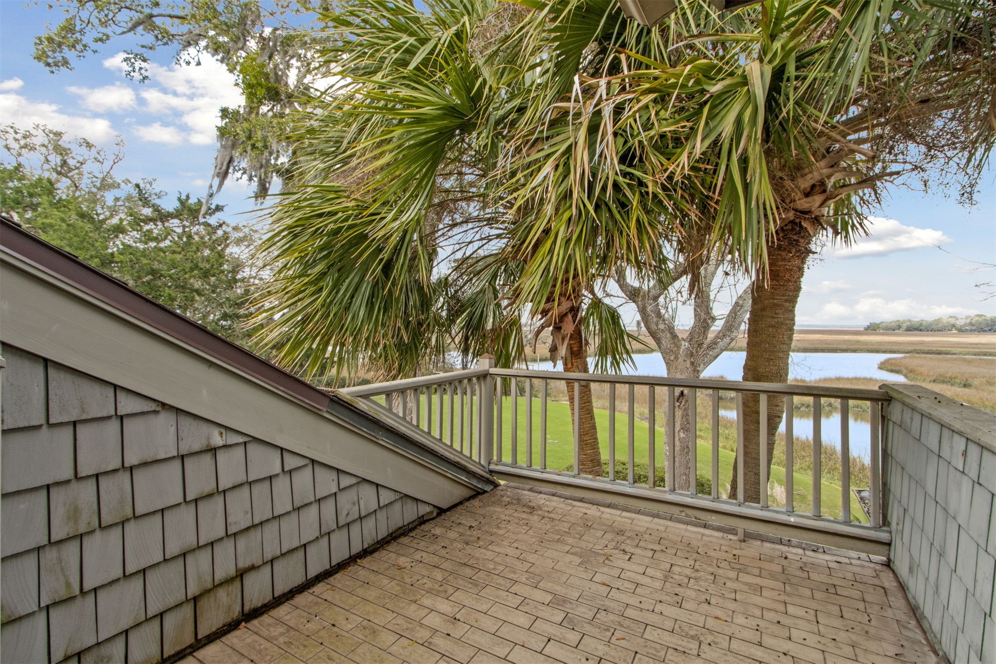 76 Marsh Creek Road Amelia Island, FL 32034 - Photo 56 of 100 a view of balcony with wooden floor and fence