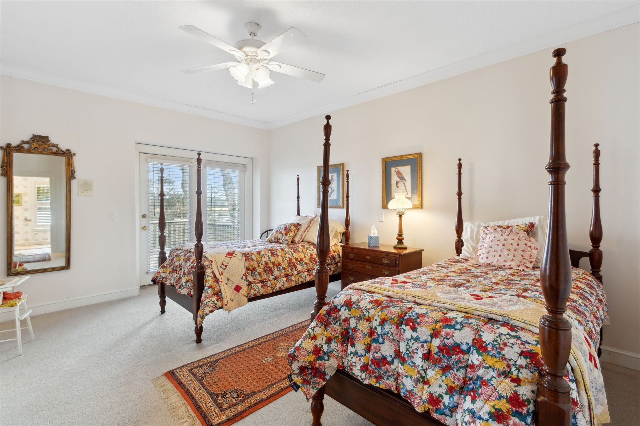 76 Marsh Creek Road Amelia Island, FL 32034 - Photo 57 of 100 a bedroom with a bed and a chandelier