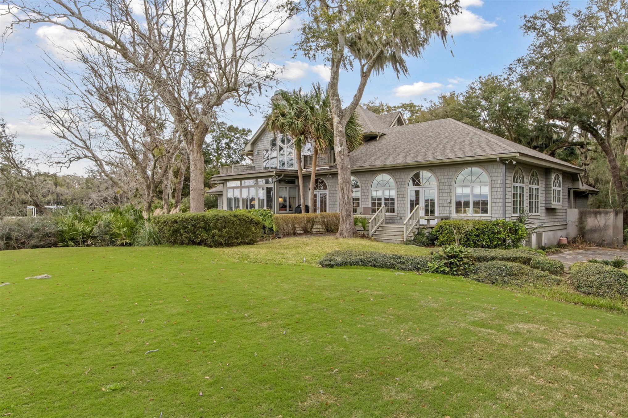 76 Marsh Creek Road Amelia Island, FL 32034 - Photo 77 of 100 a front view of a house with garden