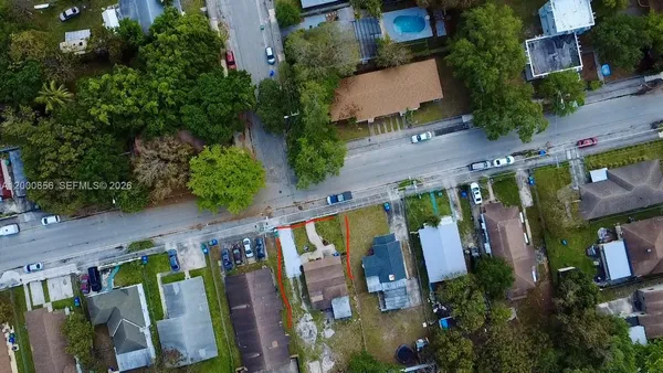 an aerial view of multiple houses with yard