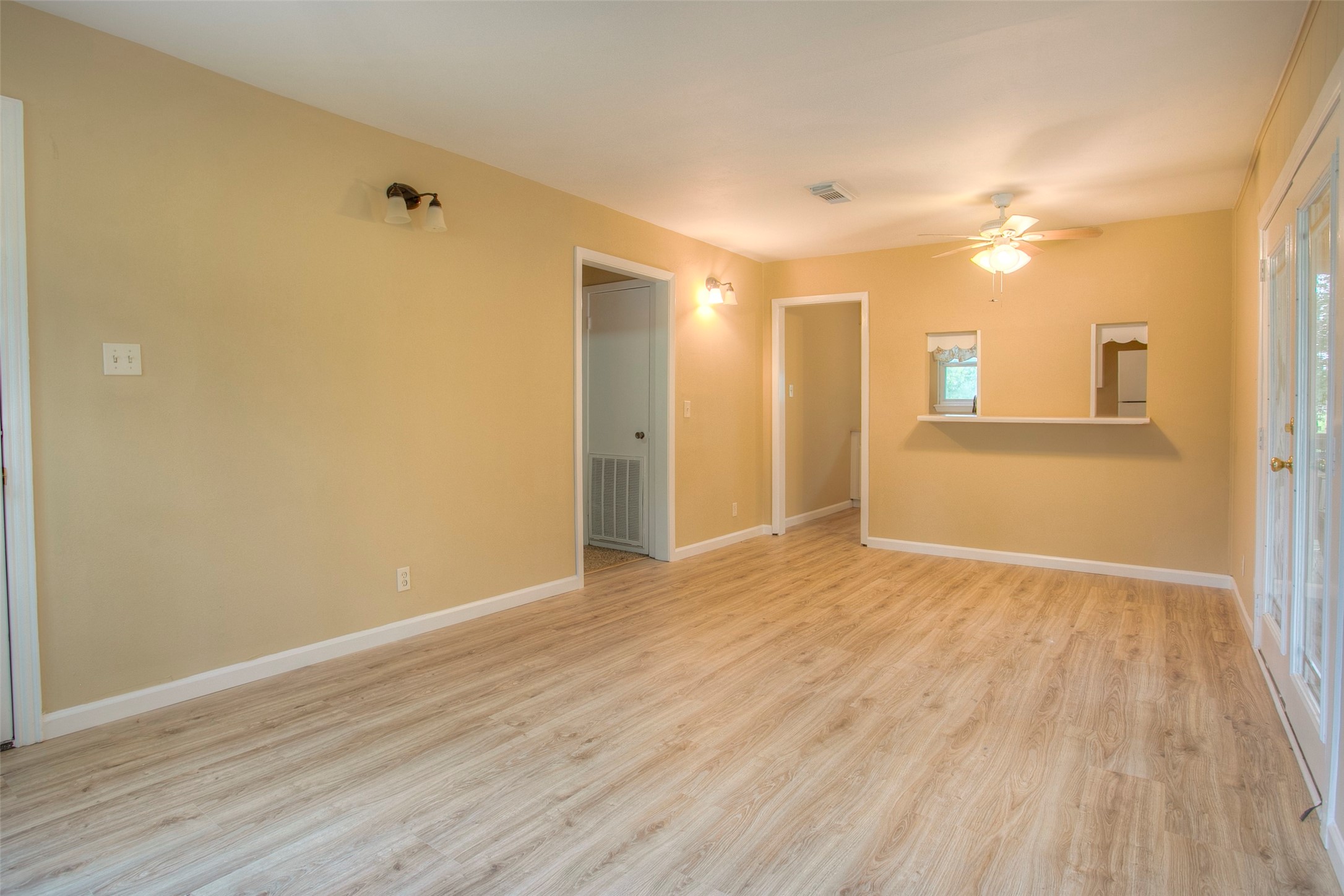 81 Westlake Road Trinity, TX 75862 - Photo 10 of 23 a view of empty room with wooden floor and fan