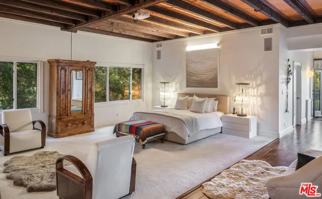 a bed room with a bed and a couch