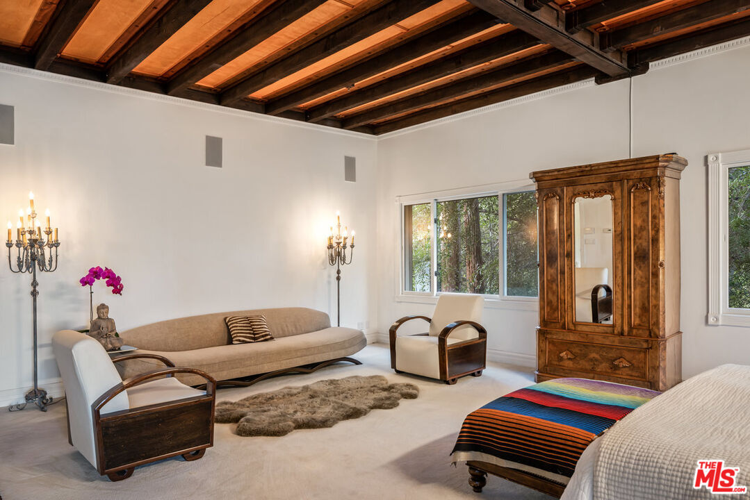 7770 Firenze Avenue Los Angeles, CA 90046 - Photo 12 of 32 a living room with furniture and two window