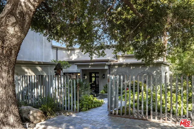 a view of street and small garden