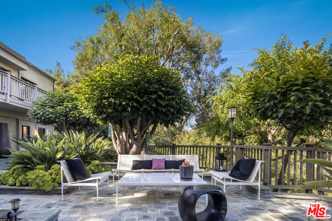 7770 Firenze Avenue Los Angeles, CA 90046 - Photo 24 of 32 a wooden bench sitting in front of a building