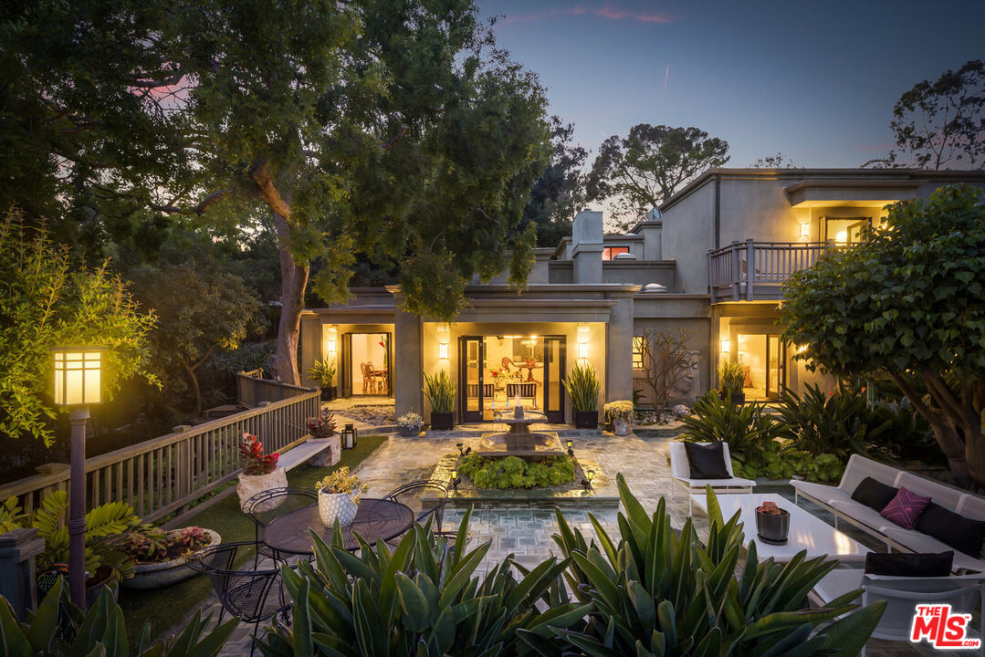 7770 Firenze Avenue Los Angeles, CA 90046 - Photo 27 of 32 a view of a patio with couches table and chairs and potted plants