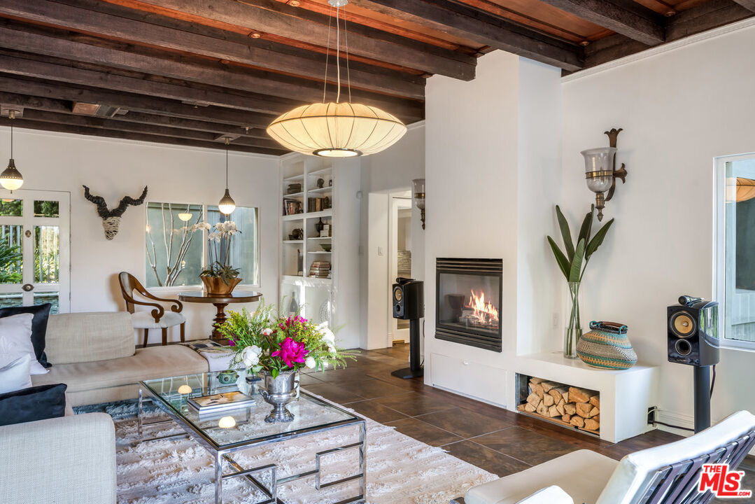 7770 Firenze Avenue Los Angeles, CA 90046 - Photo 5 of 32 a living room with furniture and wooden floor