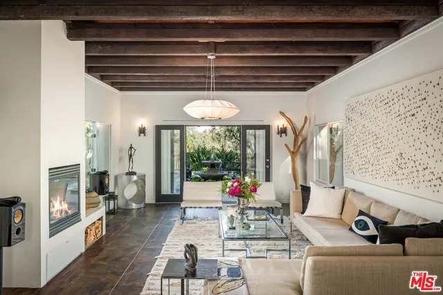 a room with furniture and a large window