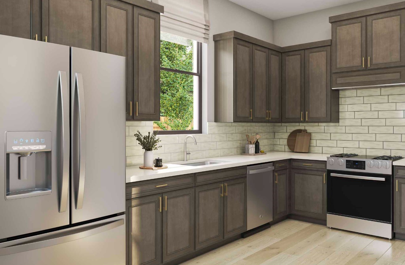 11911 Golden Cove Rosharon, TX 77583 - Photo 6 of 14 a kitchen with a sink a refrigerator and cabinets