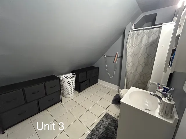 a bathroom with a sink and mirror