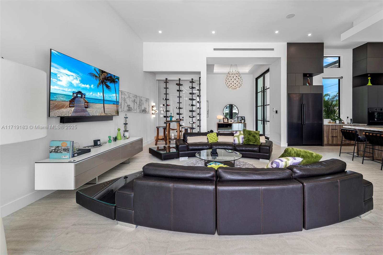 3701 Northeast 26th Avenue Lighthouse Point, FL 33064 - Photo 12 of 65 a living room with furniture and a flat screen tv