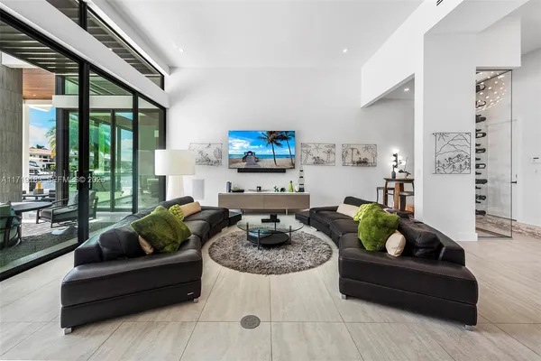 a kitchen with a table chairs and a chandelier