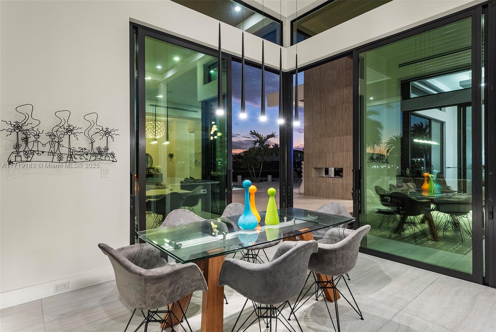 3701 Northeast 26th Avenue Lighthouse Point, FL 33064 - Photo 19 of 65 a view of a dining room with furniture one side kitchen view and a potted plant