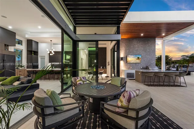 a swimming pool with outdoor seating and yard