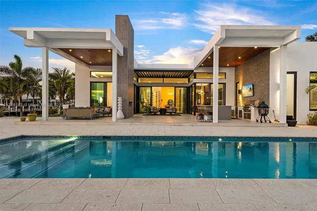 a view of a swimming pool with lounge chair