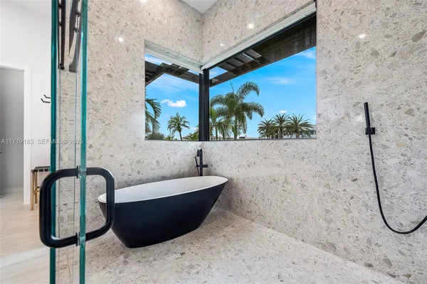 a view of a swimming pool with an outdoor seating