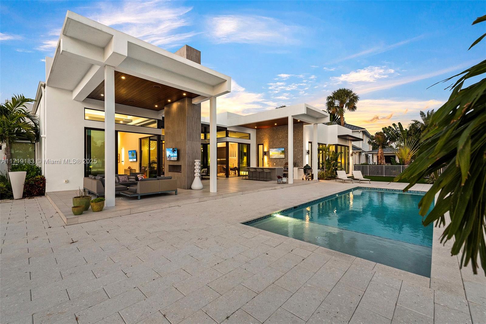 3701 Northeast 26th Avenue Lighthouse Point, FL 33064 - Photo 60 of 65 a view of a patio with swimming pool