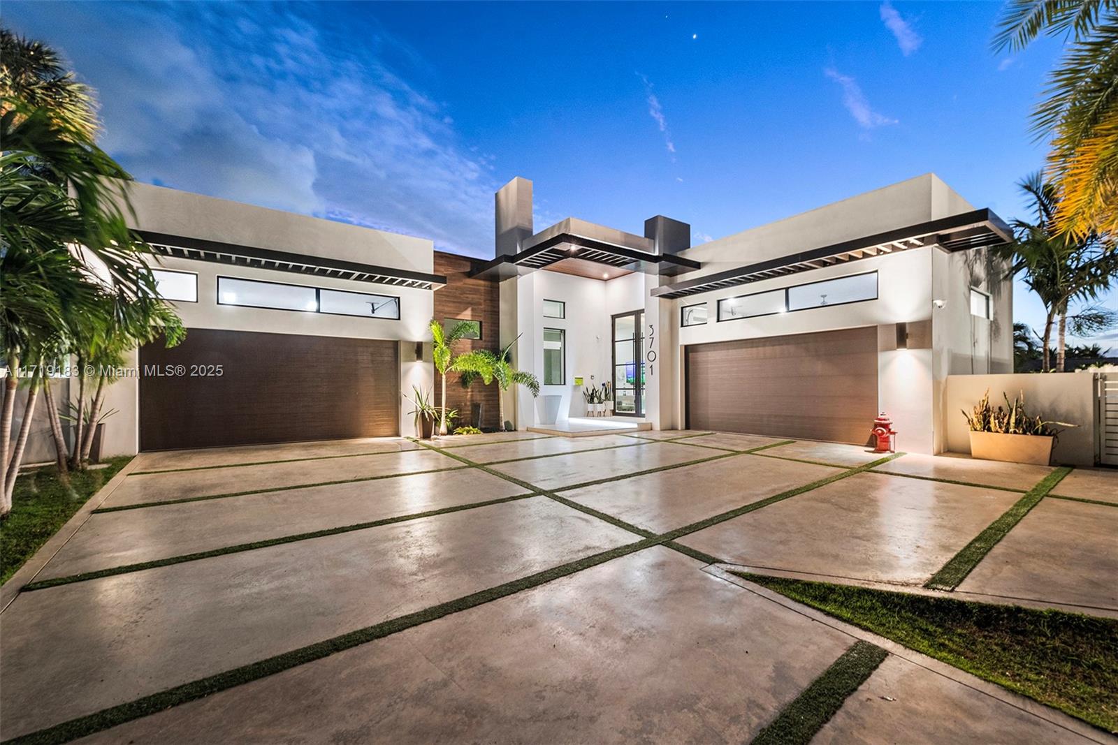 3701 Northeast 26th Avenue Lighthouse Point, FL 33064 - Photo 7 of 65 a view of a building with car parked on road