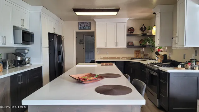 a kitchen with a sink a stove and refrigerator