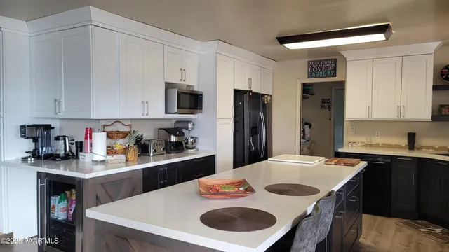 a kitchen with a sink a stove and refrigerator