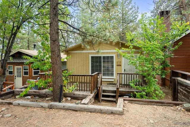 a view of a bench in front of a house