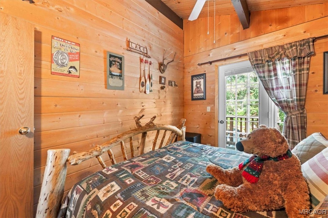 817 Maple Lane Sugarloaf, CA 92386 - Photo 15 of 23 a bedroom with a bed and a window