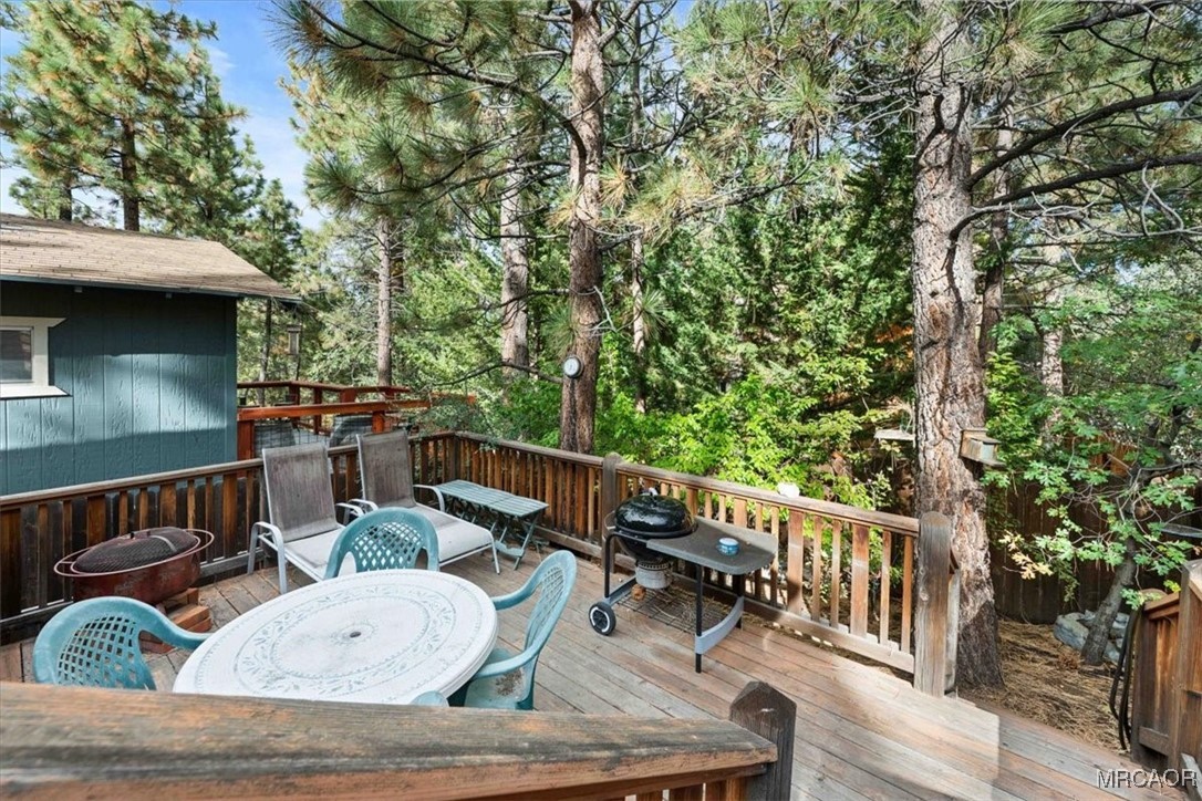 817 Maple Lane Sugarloaf, CA 92386 - Photo 21 of 23 a view of balcony with furniture and trees