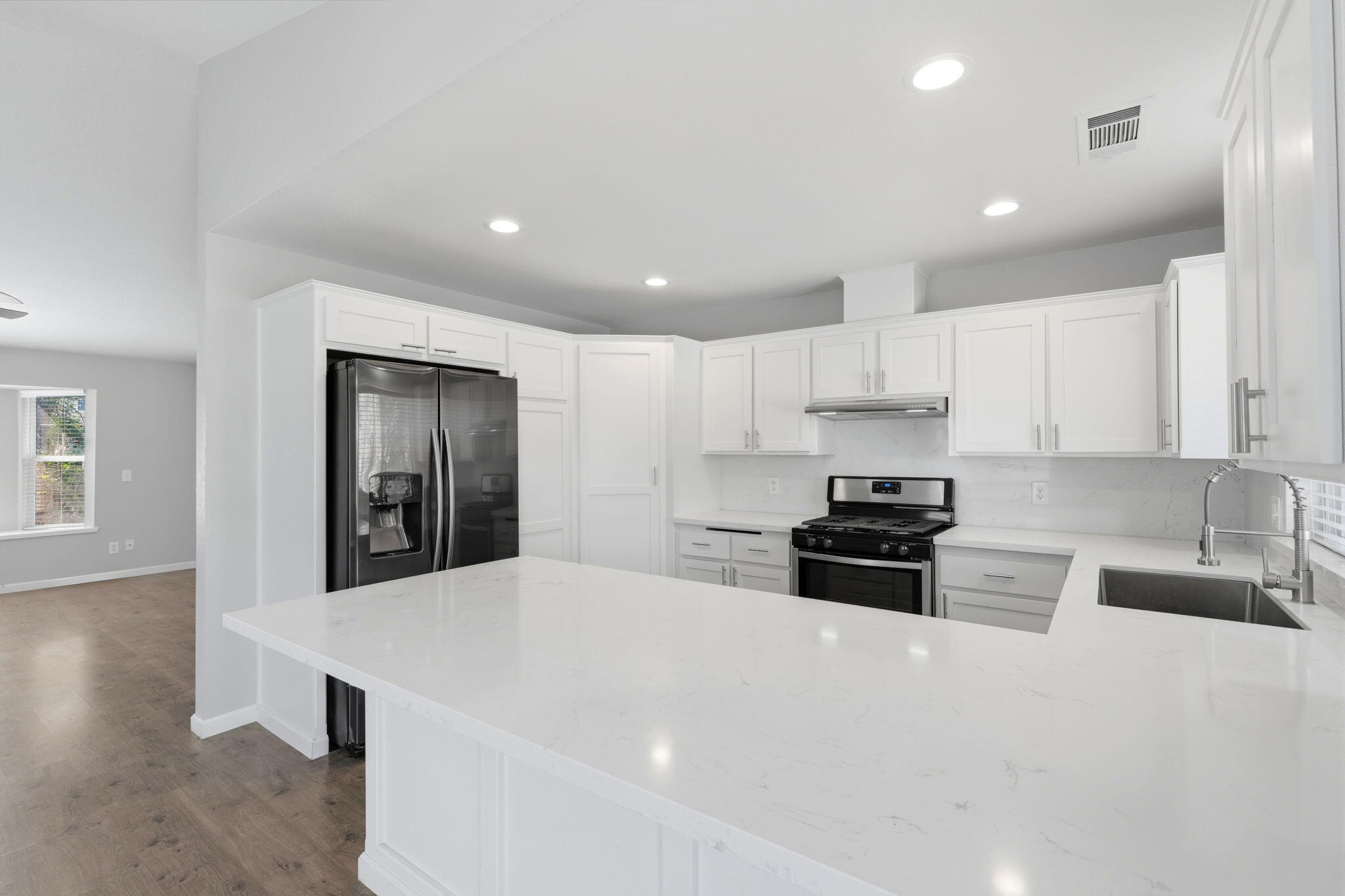 481 Katelyn Court Exeter, CA 93221 - Photo 25 of 33 a kitchen with stainless steel appliances a stove a sink a refrigerator a cabinets and a refrigerator