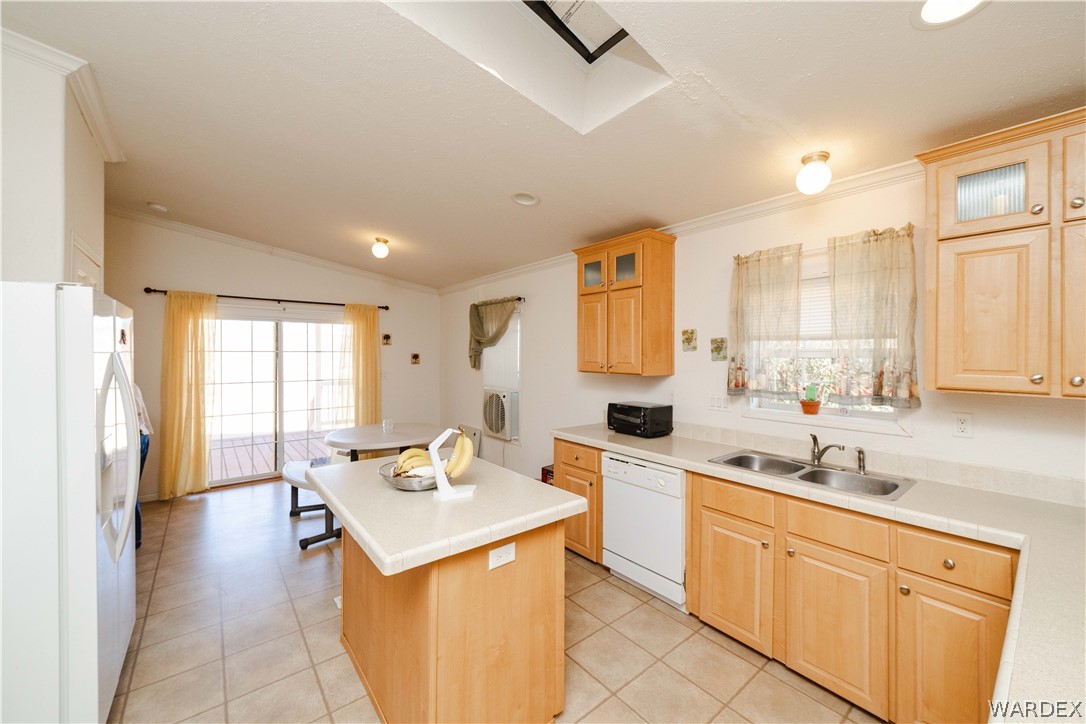 3190 East Pepper Tree Road Kingman, AZ 86409 - Photo 7 of 67 a kitchen with a sink stove and cabinets