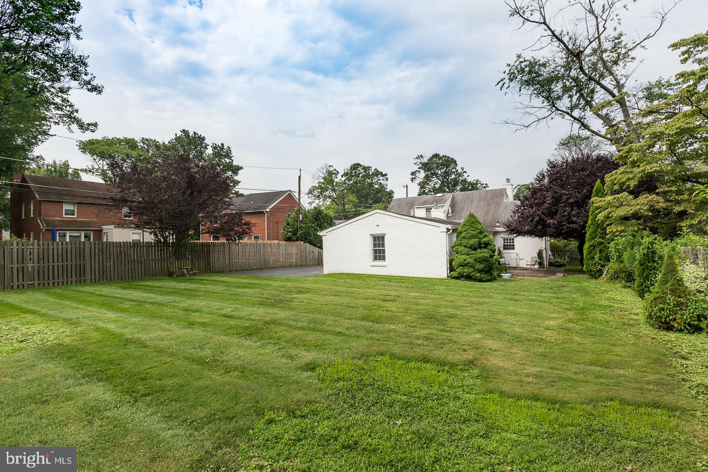 339 East Spring Avenue Ardmore, PA 19003 - Photo 42 of 44 a backyard of a house with lots of green space and garden