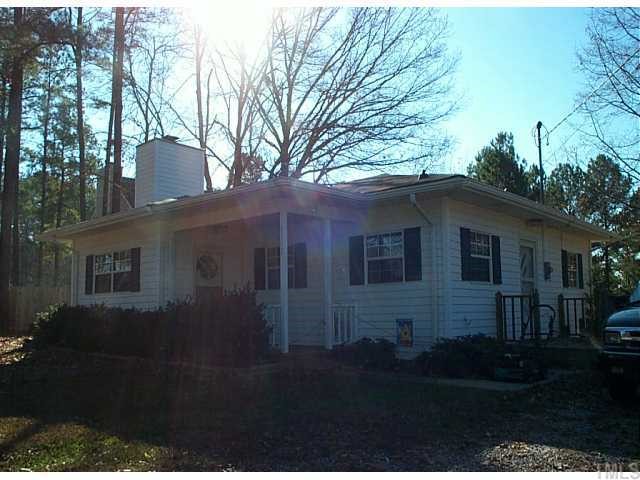 1201 Lynn Road Raleigh, NC 27612 - Photo 1 of 1 a front view of a house with a yard
