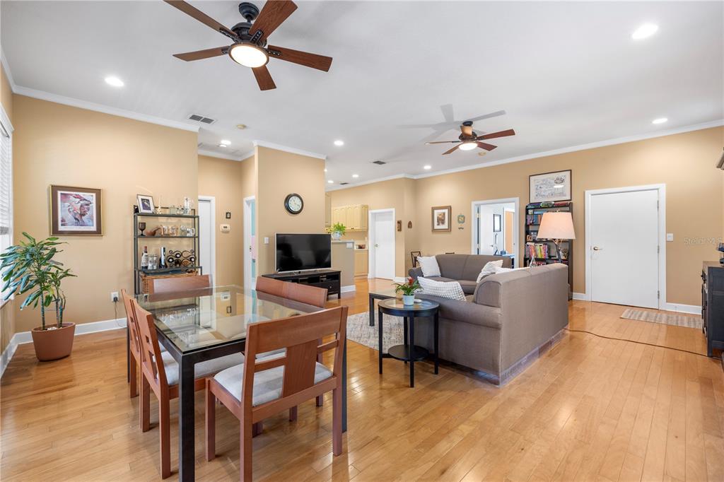 11951 Sheldon Road Tampa, FL 33626 - Photo 13 of 51 a living room with furniture kitchen view and a wooden floor