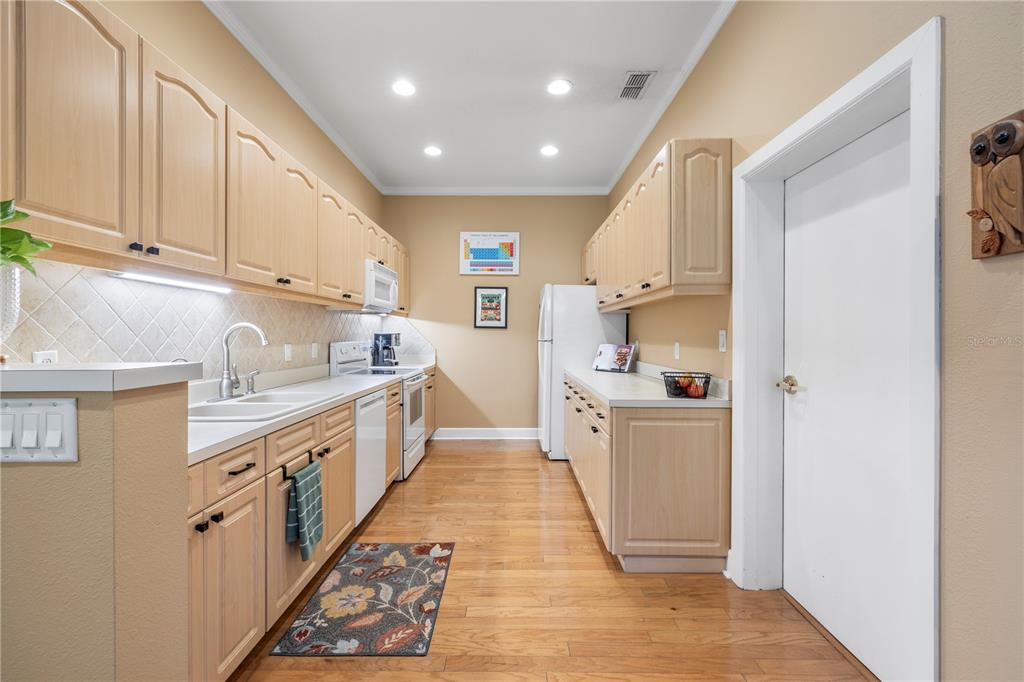 11951 Sheldon Road Tampa, FL 33626 - Photo 16 of 51 a large kitchen with stainless steel appliances granite countertop a lot of counter space and a sink