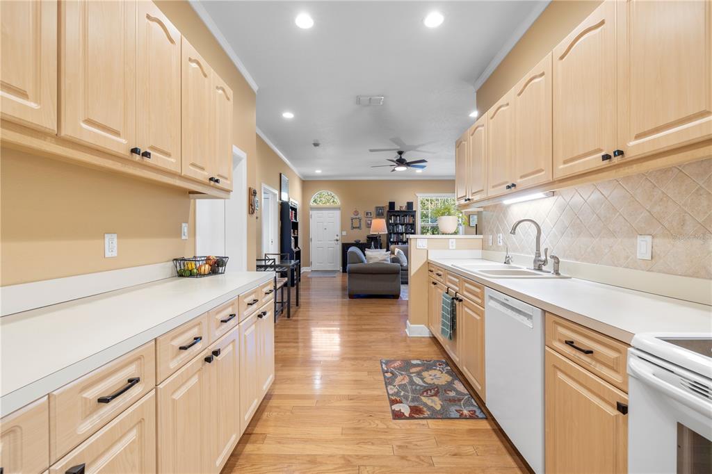 11951 Sheldon Road Tampa, FL 33626 - Photo 19 of 51 a large kitchen with stainless steel appliances granite countertop a sink and cabinets
