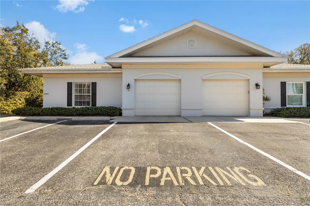 11951 Sheldon Road Tampa, FL 33626 - Photo 2 of 51 a front view of a house with a yard