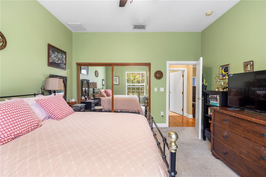 11951 Sheldon Road Tampa, FL 33626 - Photo 29 of 51 a bedroom with a bed and furniture