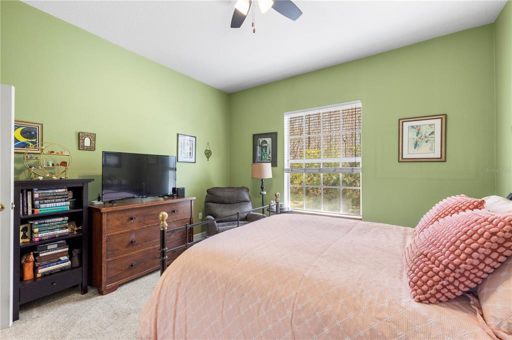 11951 Sheldon Road Tampa, FL 33626 - Photo 30 of 51 a bedroom with a bed and furniture