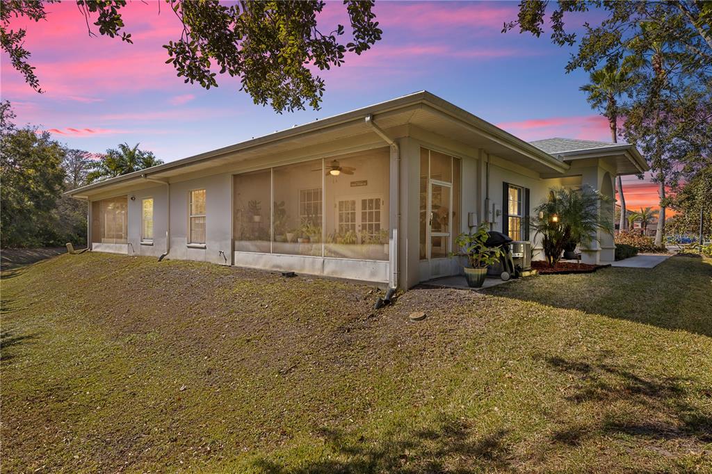 11951 Sheldon Road Tampa, FL 33626 - Photo 36 of 51 a front view of a house with a yard