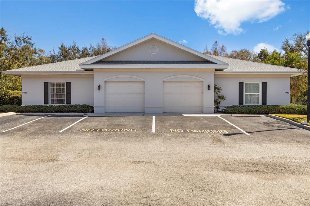 11951 Sheldon Road Tampa, FL 33626 - Photo 41 of 51 a front view of a house with a garden
