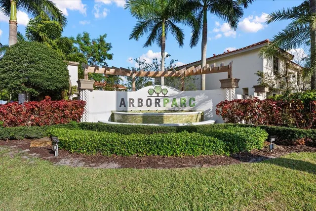 a sign that is sitting in front of a house