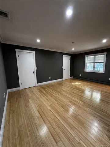 a view of an empty room and window