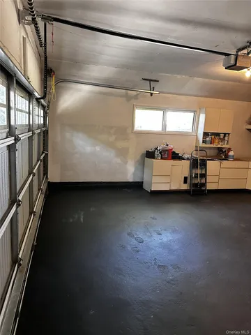 a view of a house with a wooden fence