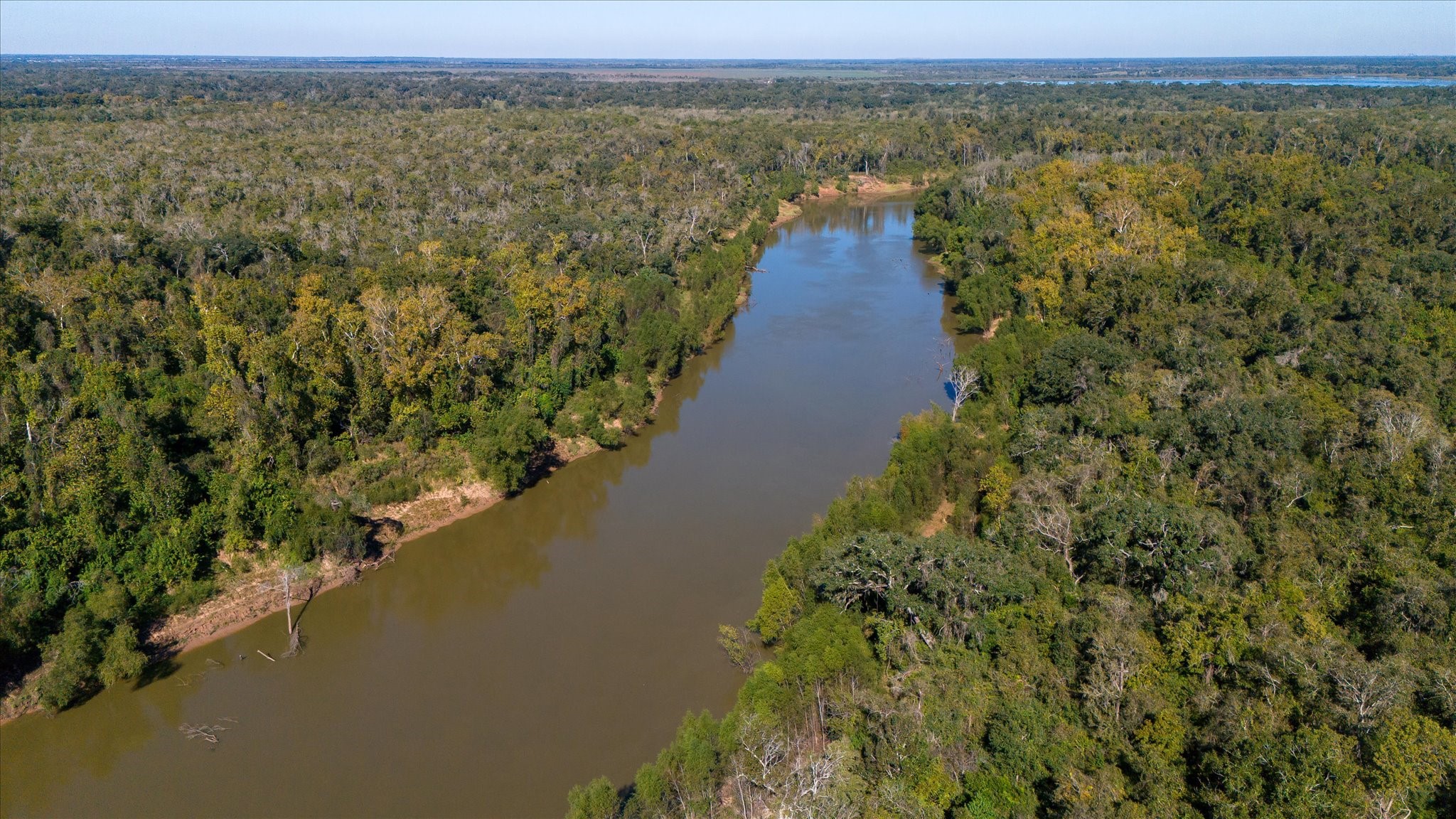 0 Cr 611 Angleton Tx 77515 Angleton, TX 77515 - Photo 14 of 33 a view of a lake with a mountain in the background