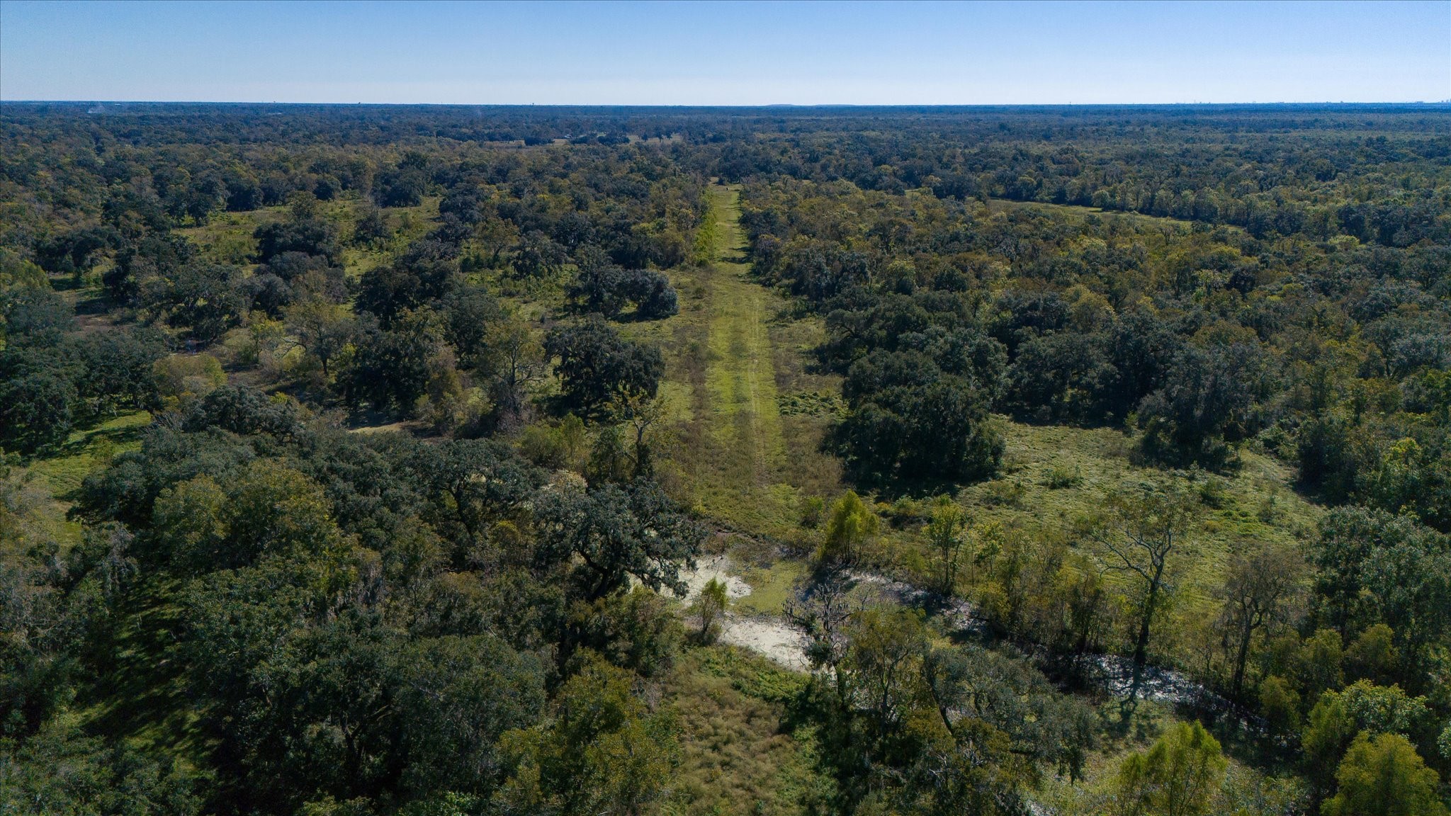 0 Cr 611 Angleton Tx 77515 Angleton, TX 77515 - Photo 17 of 33 an aerial view of residential houses with outdoor space and trees