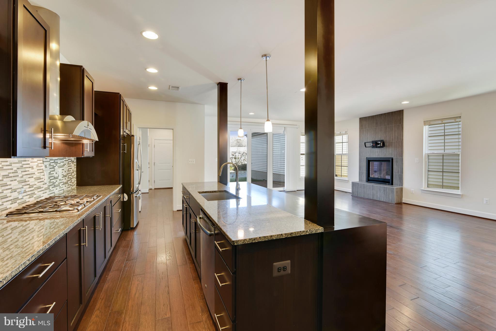20442 Codman Drive Ashburn, VA 20147 - Photo 8 of 37 Kitchen with granite and stainless appliances.