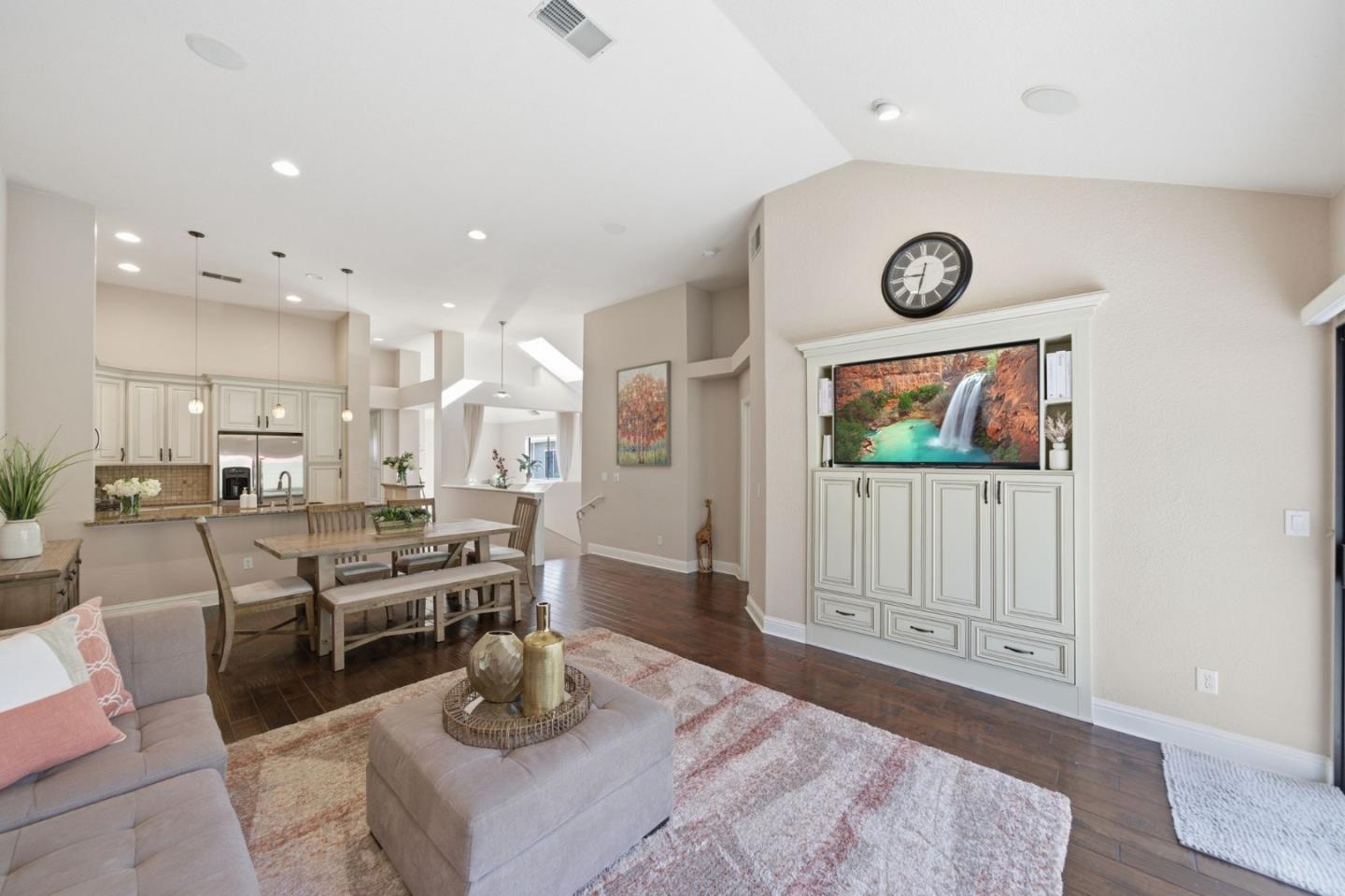 a living room with lots of furniture and kitchen view